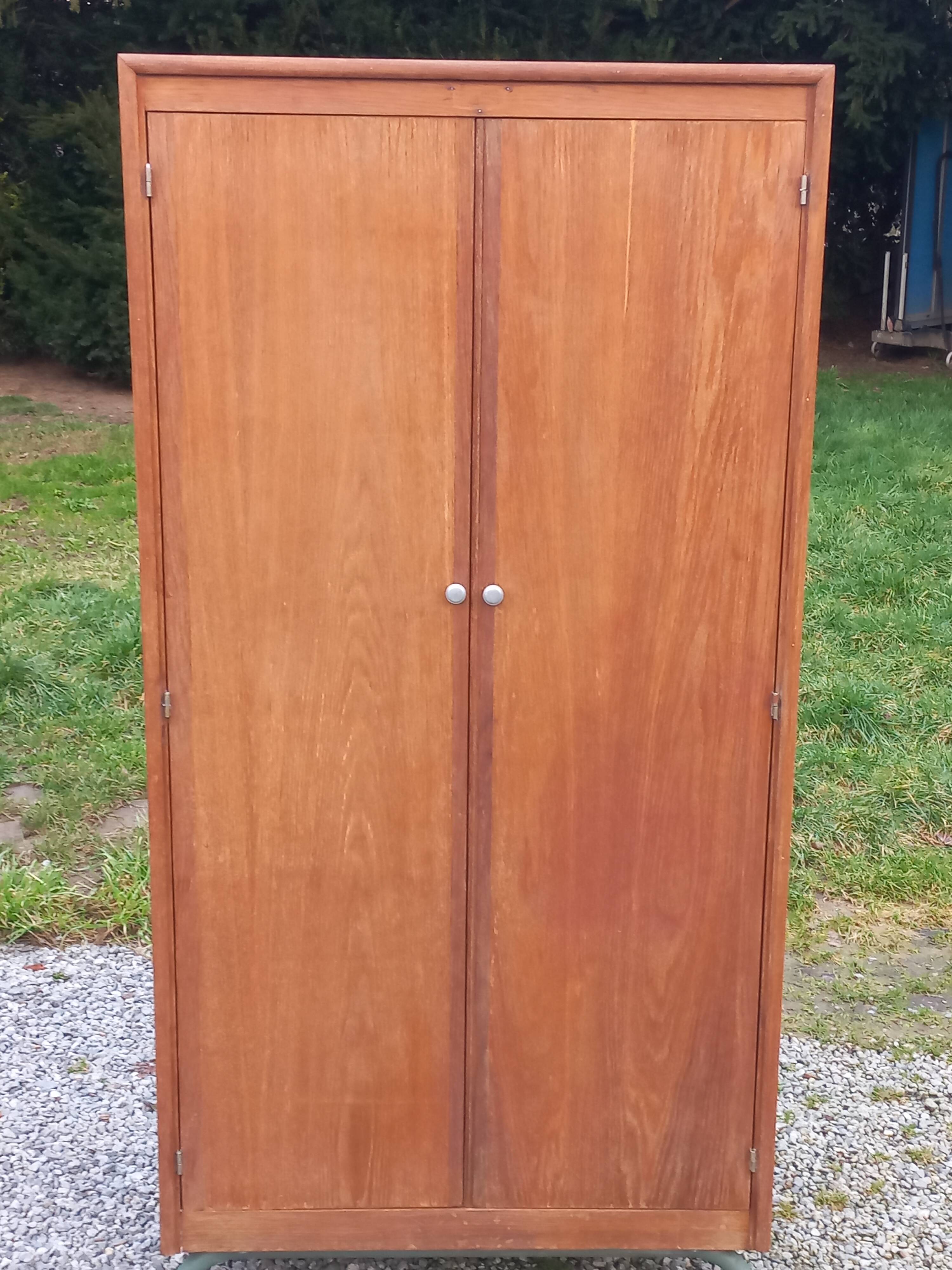 Vintage oak wardrobe with metal legs from the 1950s.