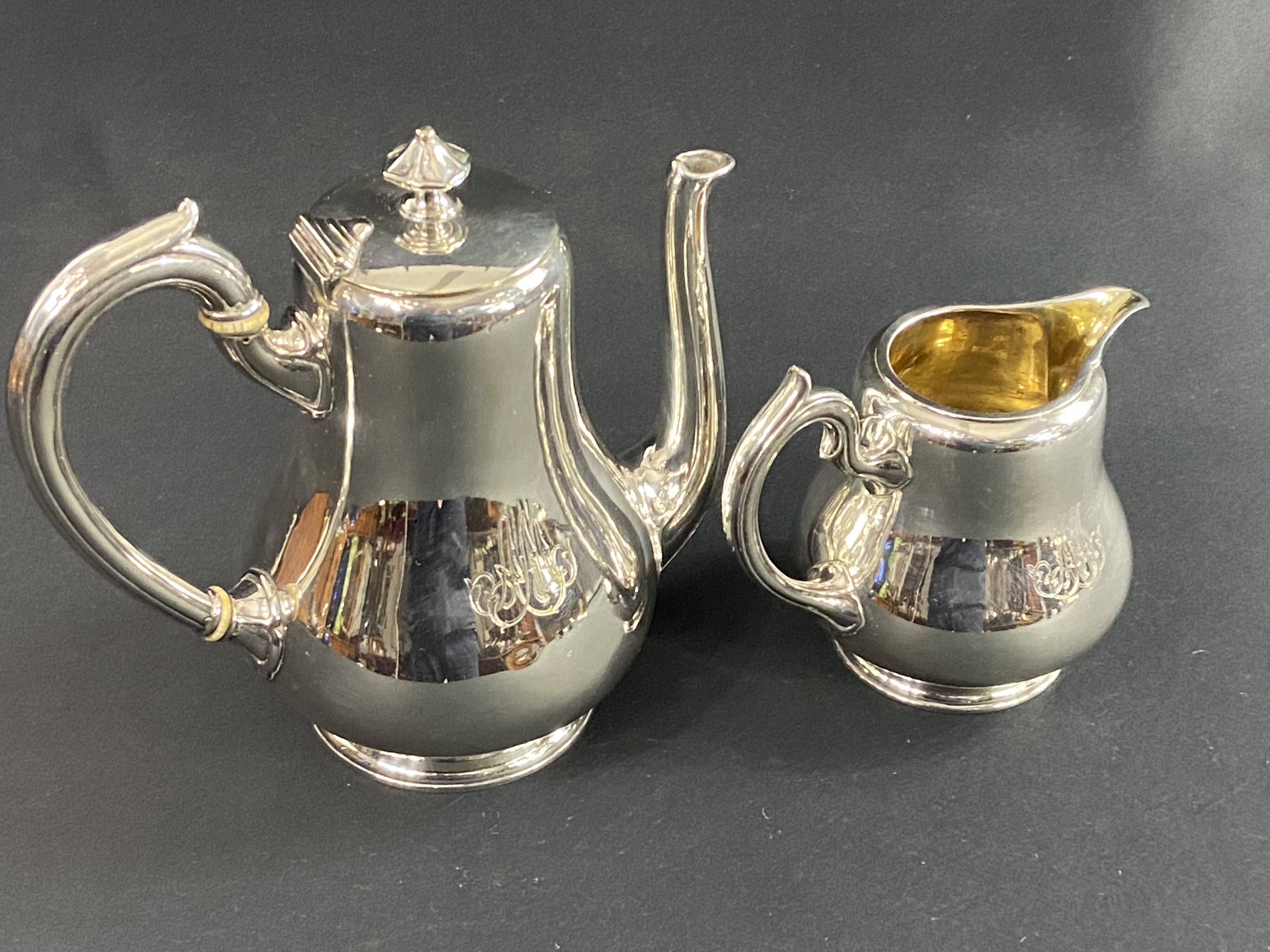 Silver-plated coffee pot and milk jug monogrammed MA, signed CHRISTOFLE.