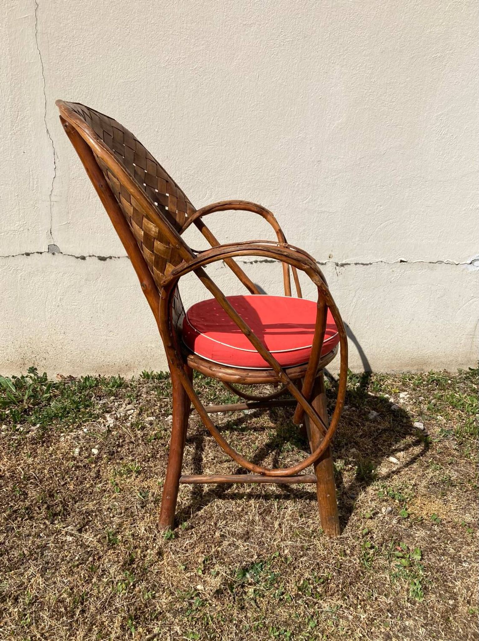 Vintage 1970s armchair in curved woven chestnut + seat cushion
