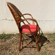 Vintage 1970s armchair in curved woven chestnut + seat cushion