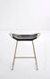 Contemporary sculptural organic bar stool, aged brass metal and black leather.