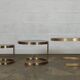 Superb trundle table round golden and smoked glass