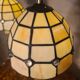 pair of bedside lamps in gilded bronze with glass shade