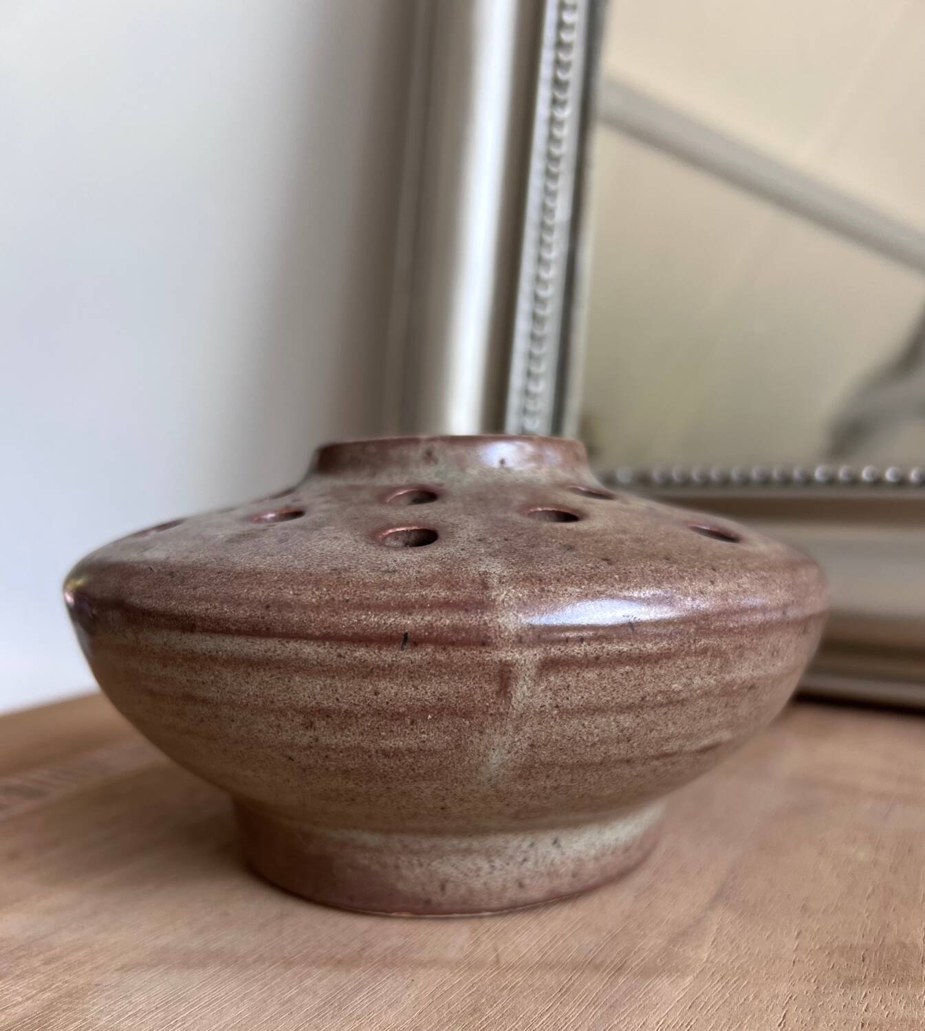 Vintage flower pot in perforated handcrafted stoneware, flattened round shape, p