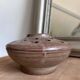 Vintage flower pot in perforated handcrafted stoneware, flattened round shape, p