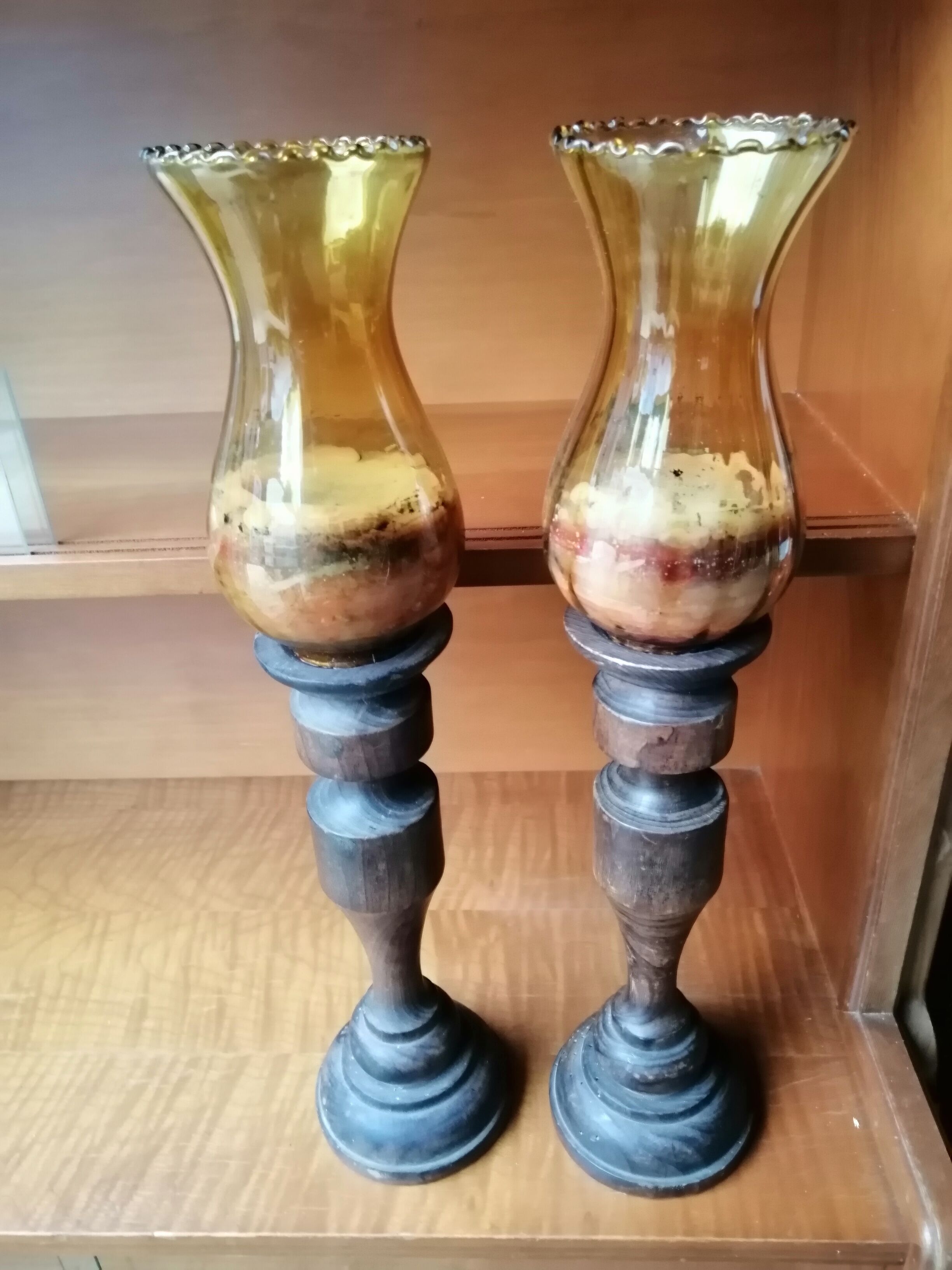 Pair of wooden candle holders and antique glass
