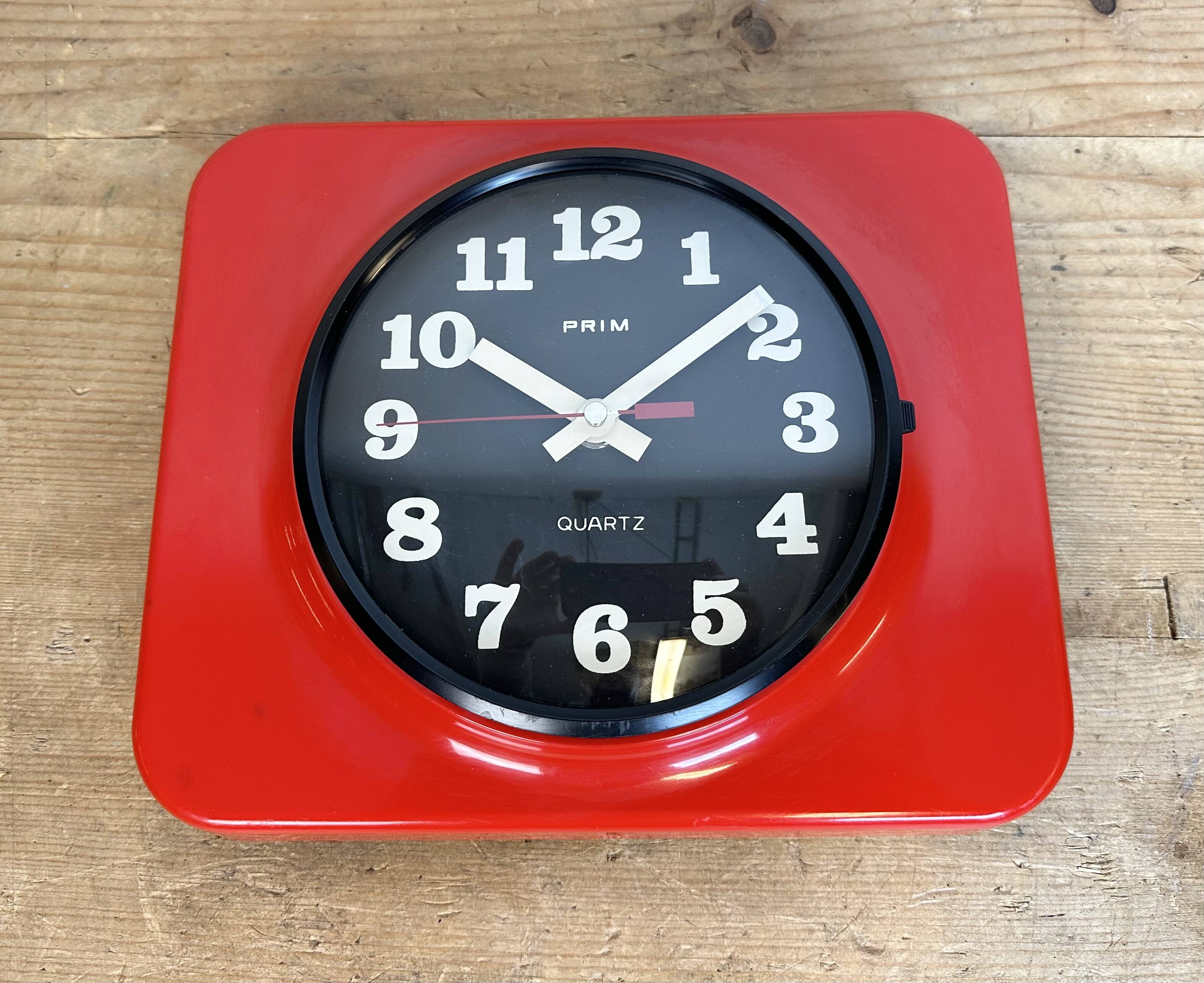 Vintage red bakelite wall clock from prim, 1970s