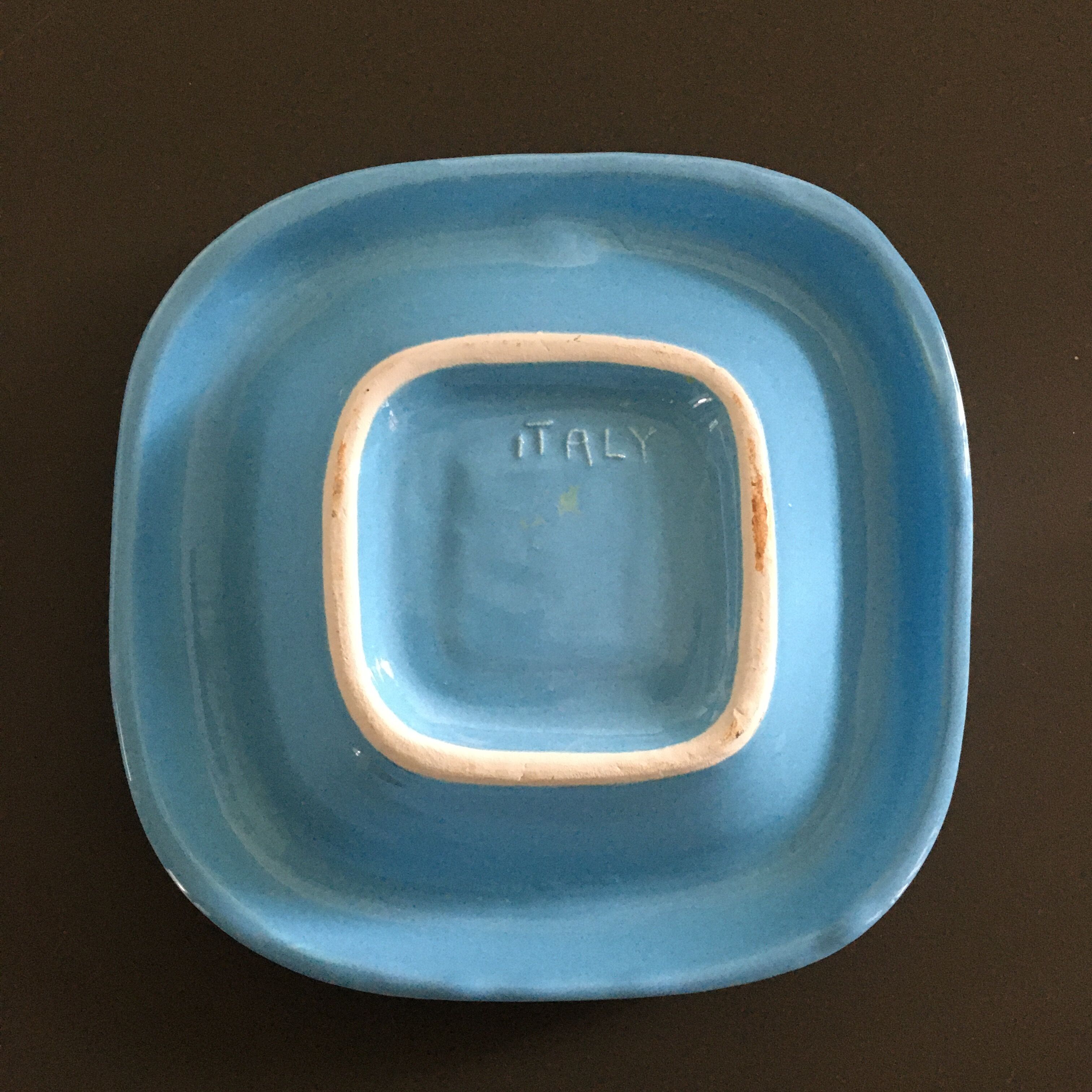 Empty turquoise earthenware pocket