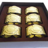 Six rounds of brass towel in their original box 1960  Art Deco