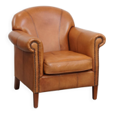 Cognac-colored cowhide leather armchair