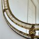 Vintage Spanish Venetian-style wall mirror, oval, brass, 1980s Hollywood Regency