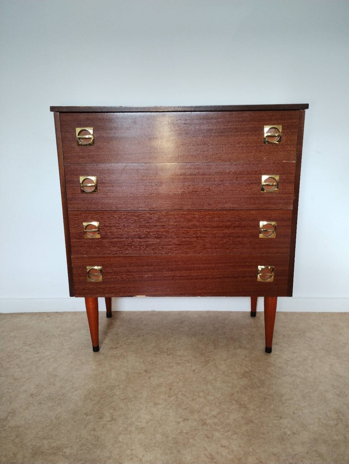 Chest of drawers with spindle legs
