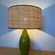 Vintage green glazed ceramic lamp and cane shade