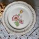Pitted old flat earthenware plates with gold