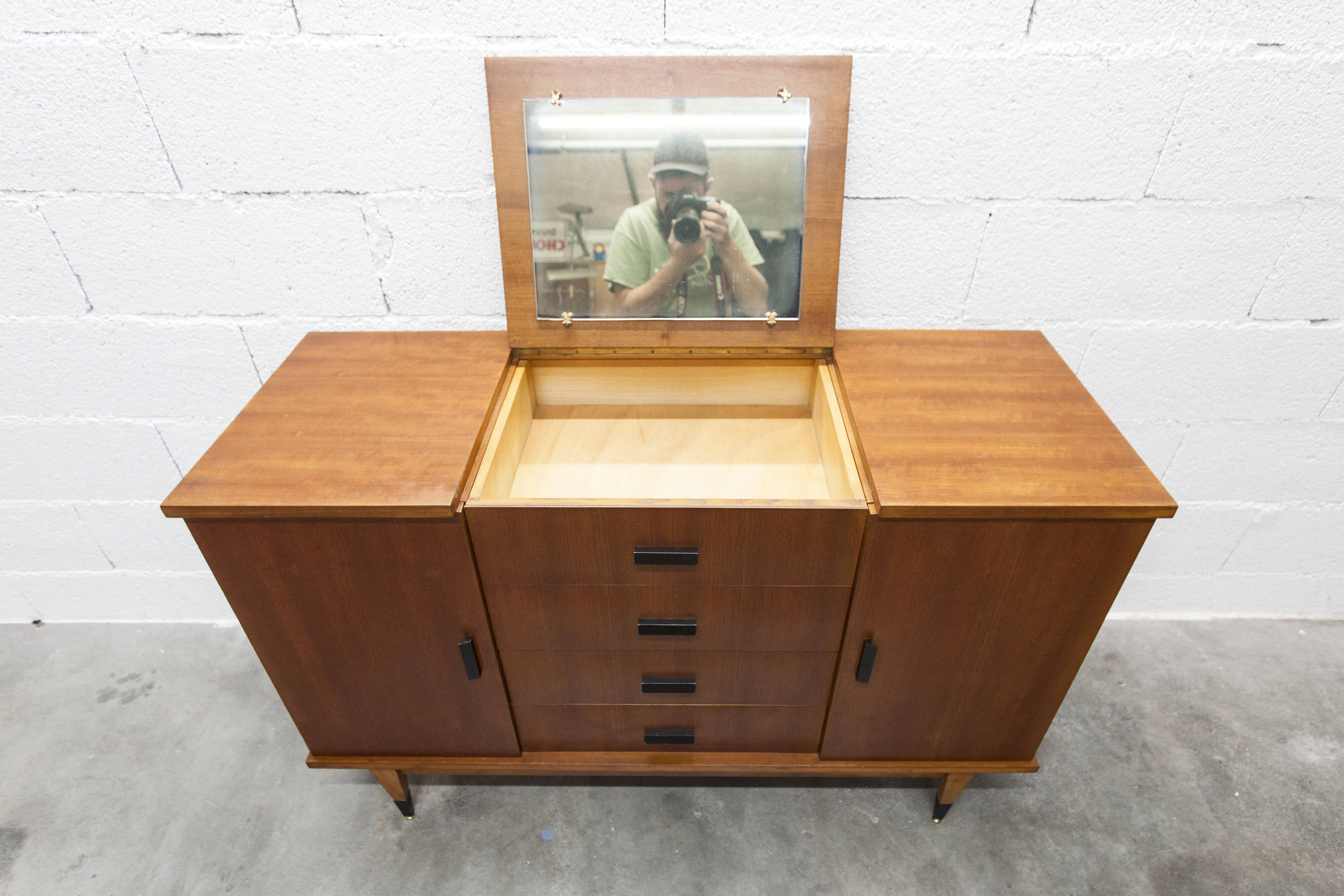 1960s teak sideboard with 4 drawers, 2 doors, and a mirror.