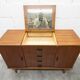 1960s teak sideboard with 4 drawers, 2 doors, and a mirror.