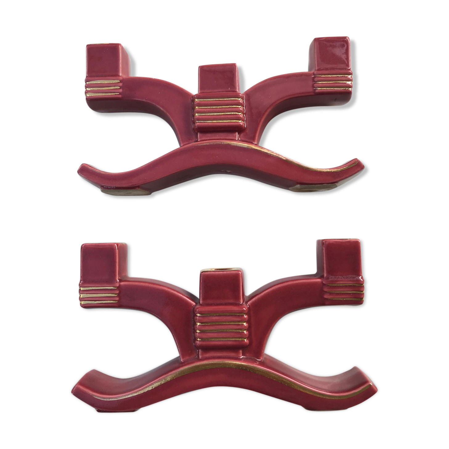 Former pair of burgundy ceramic candlesticks