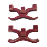 Former pair of burgundy ceramic candlesticks
