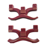 Former pair of burgundy ceramic candlesticks