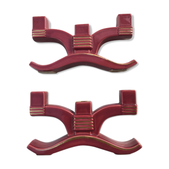 Former pair of burgundy ceramic candlesticks