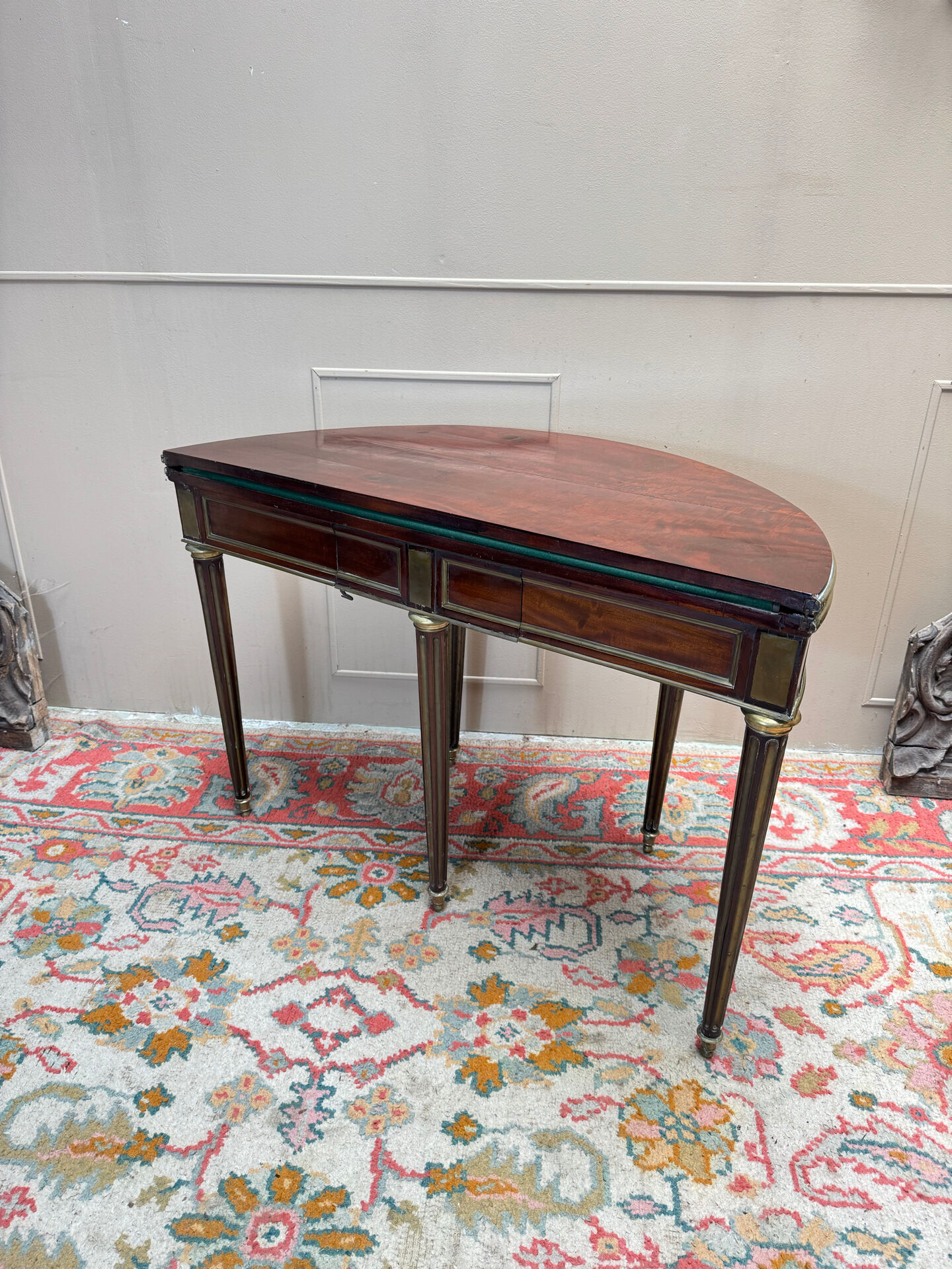 Half-moon table in mahogany from the Louis XVI period, 18th century.