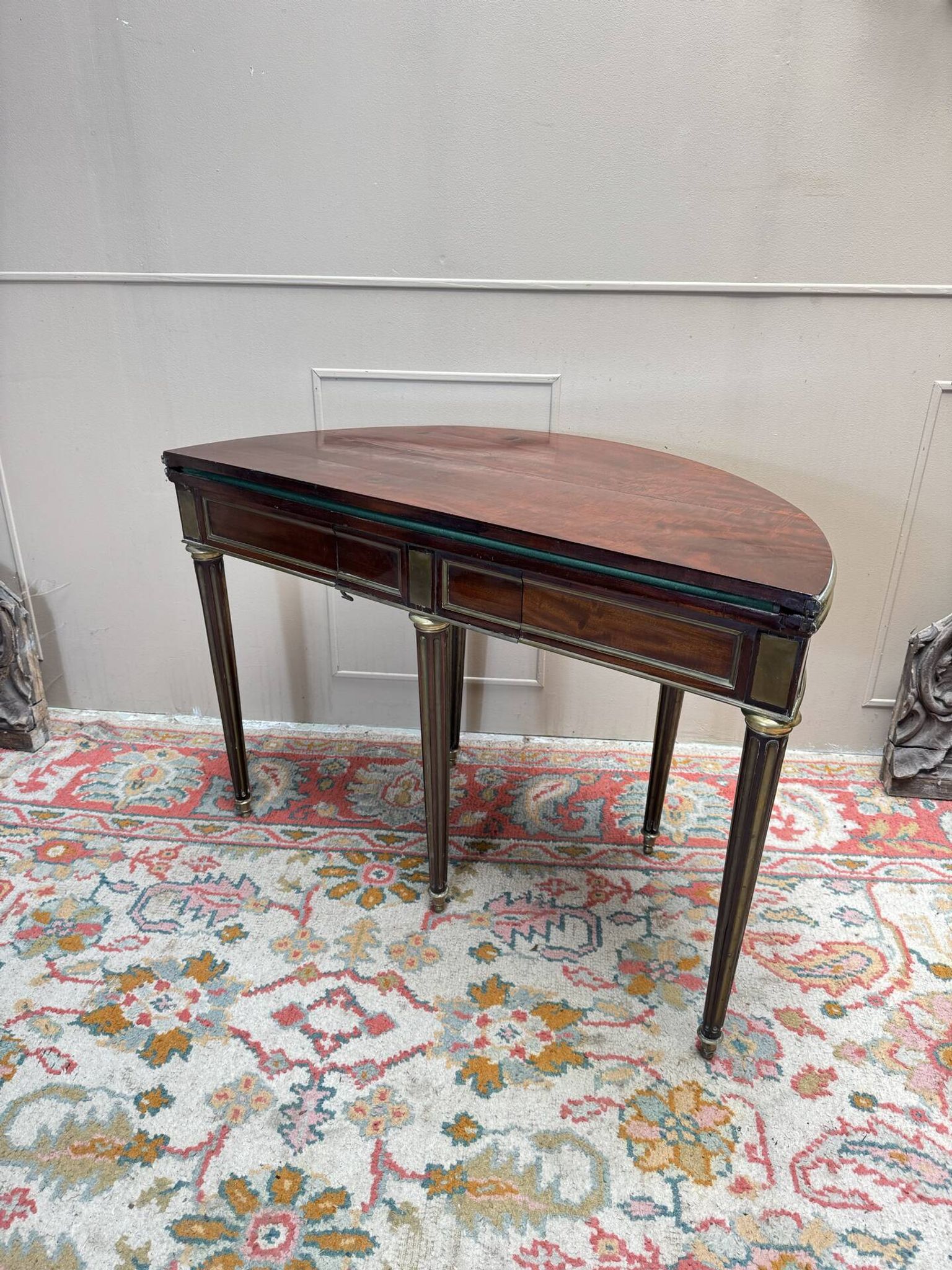 Half-moon table in mahogany from the Louis XVI period, 18th century.