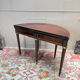 Half-moon table in mahogany from the Louis XVI period, 18th century.