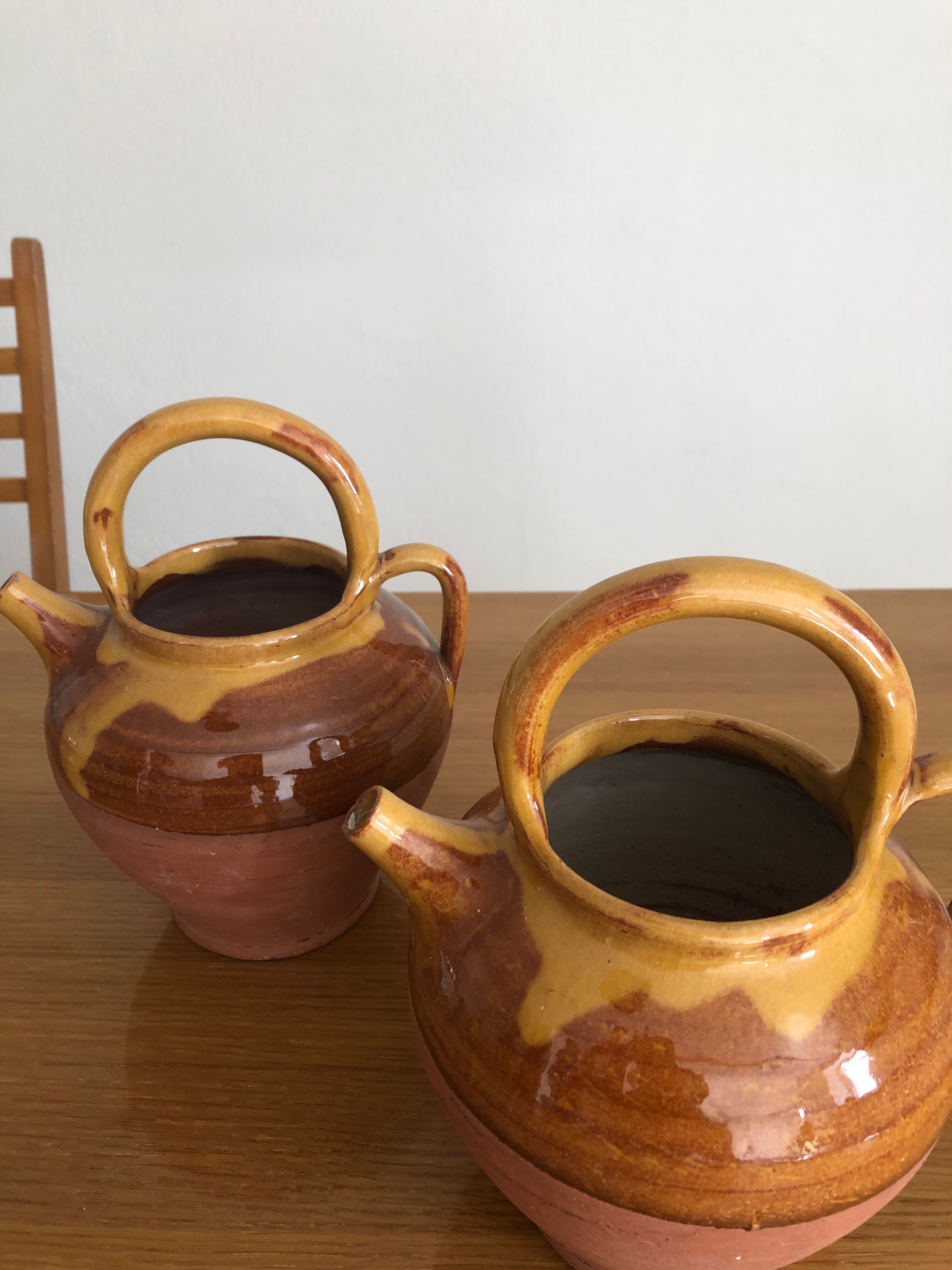Pair of vintage terracotta watering cans