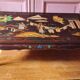 Chinese black lacquer coffee table with figurative decoration – Coromandel style – 20th century.