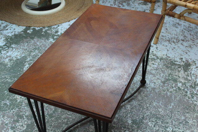 Black metal footing wooden coffee table