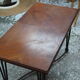Black metal footing wooden coffee table