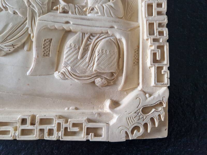 Sculpted resin plaque in the style of China.