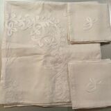 White hand-embroidered square tablecloth at stem stitch
