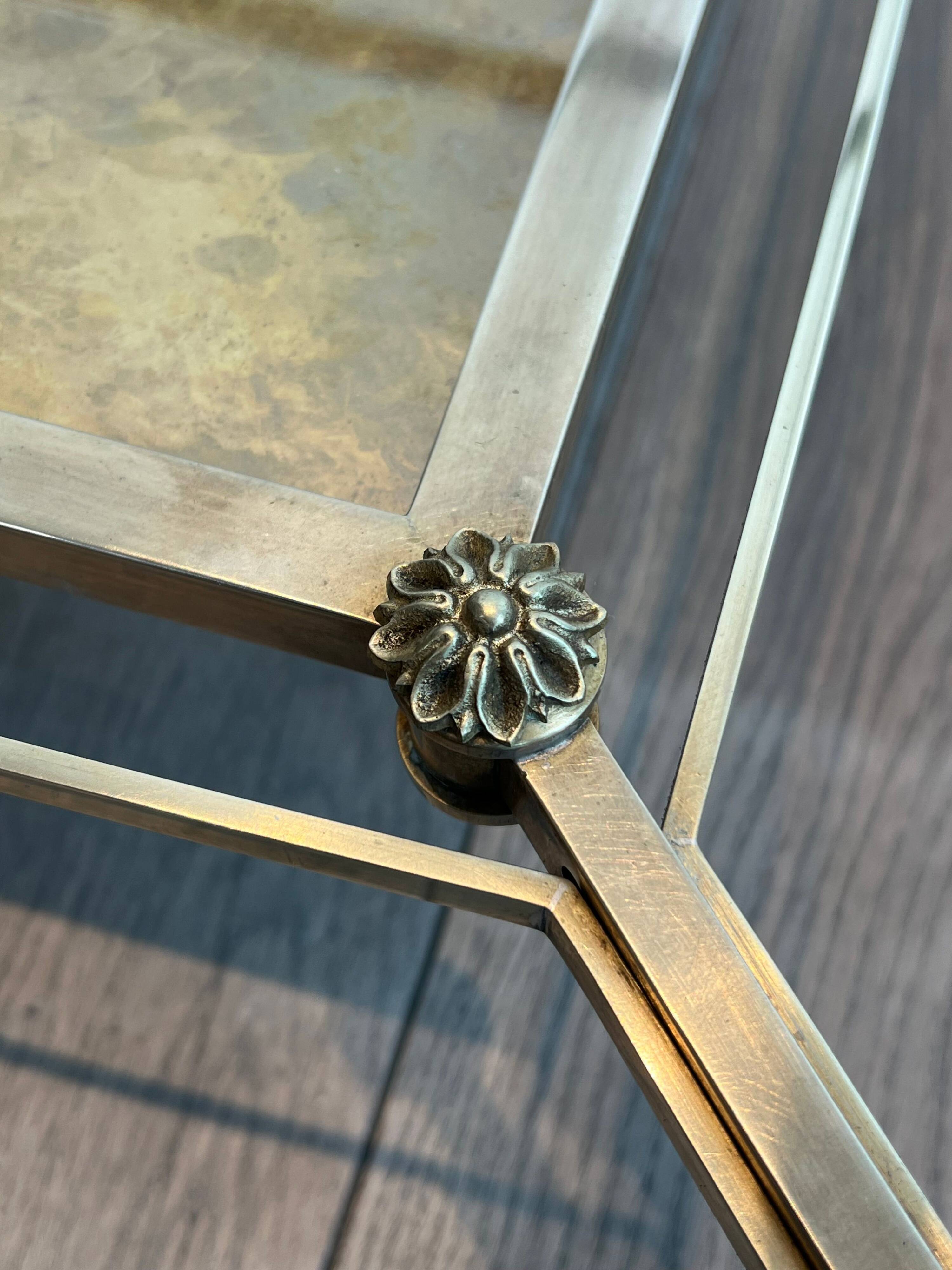 Pair of neoclassical side tables in steel and brass by Maison Jansen.