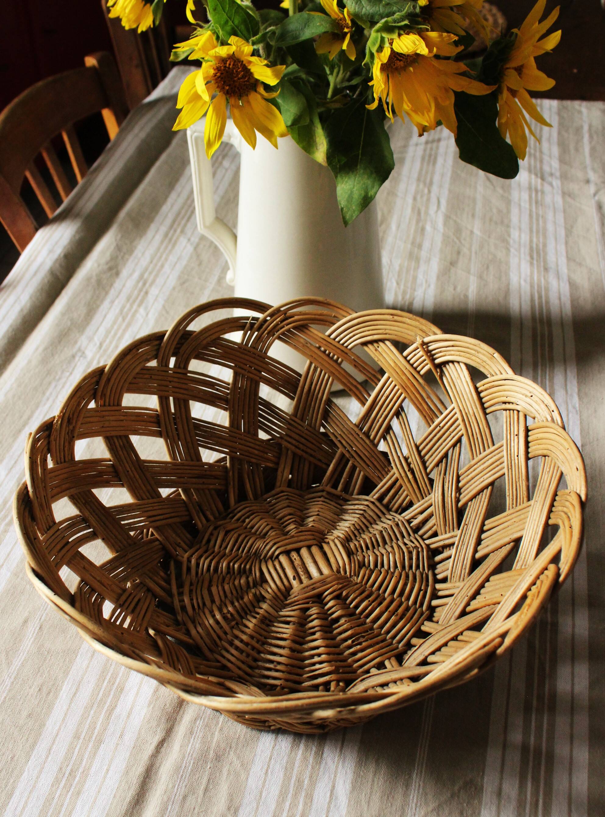 Vintage round wicker basket on stand