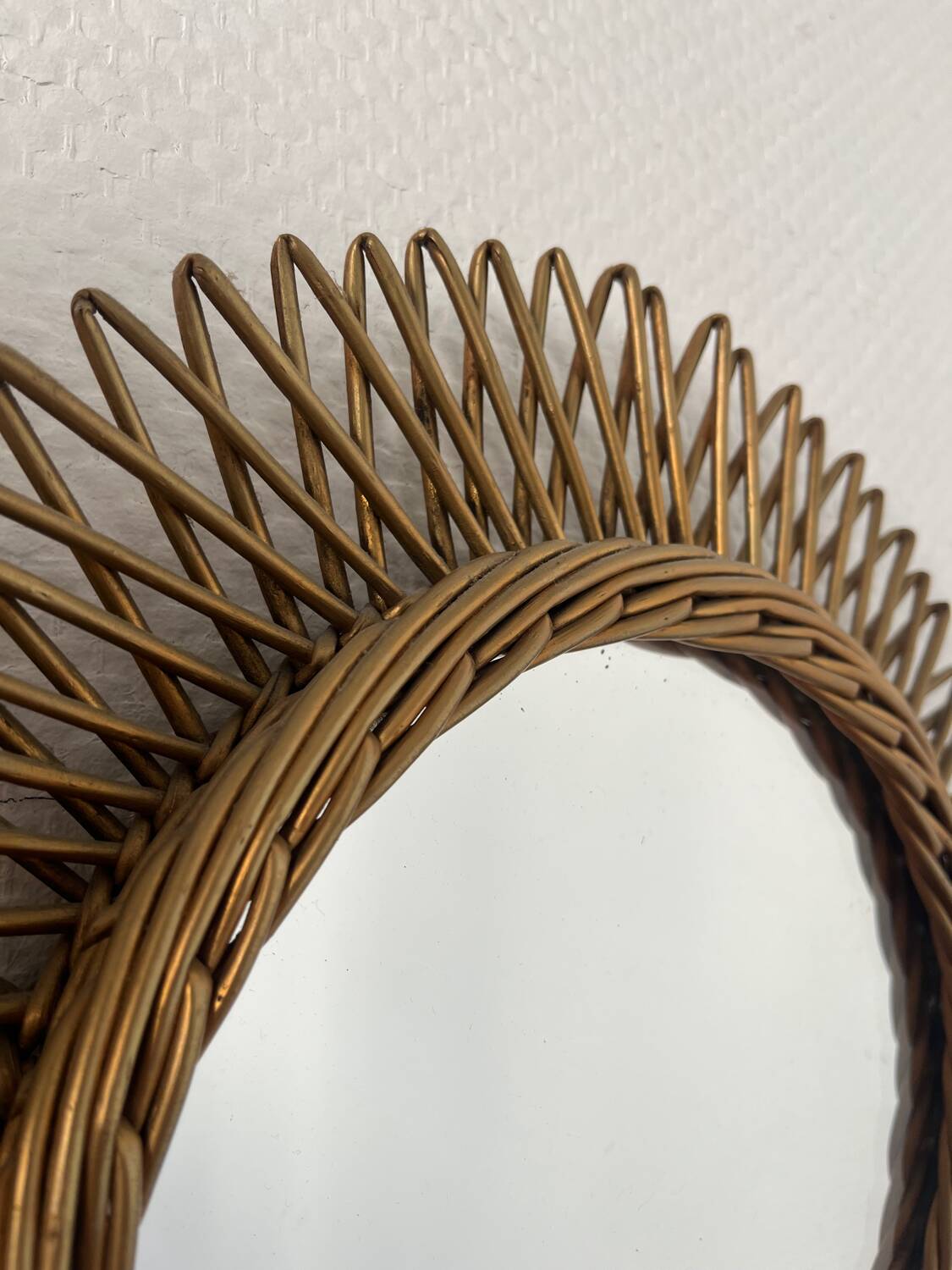 Vintage gold rattan sun mirror