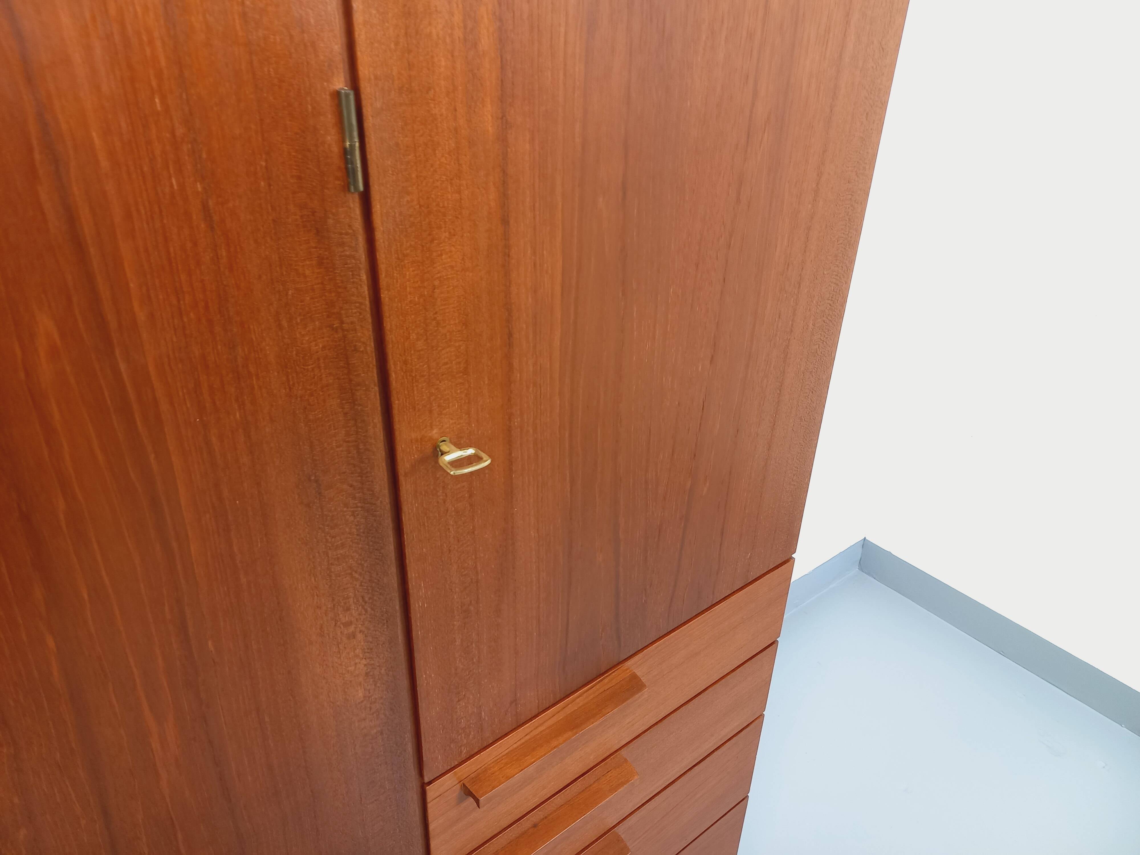 High Scandinavian modernist vintage sideboard in teak and black metal.