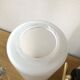 Pair of brass tube wall light and 1960s opalin glass