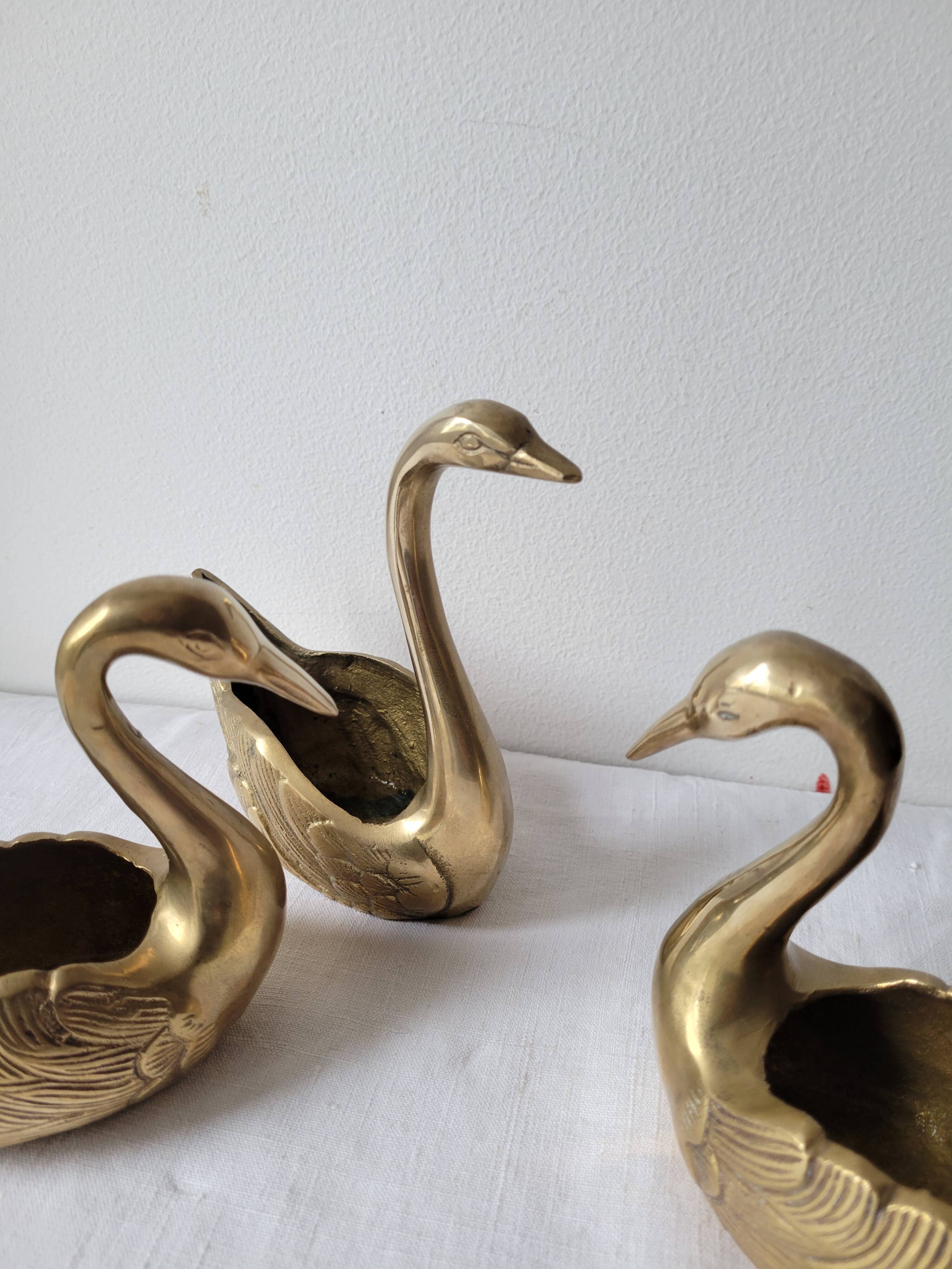 Trio of zoomorphic brass swan empty pockets