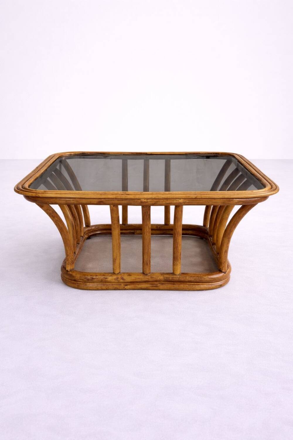 Rattan and smoked glass coffee table, vintage 1970s design.