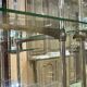 Early 20th-century shop display cabinet in oak with sliding doors.