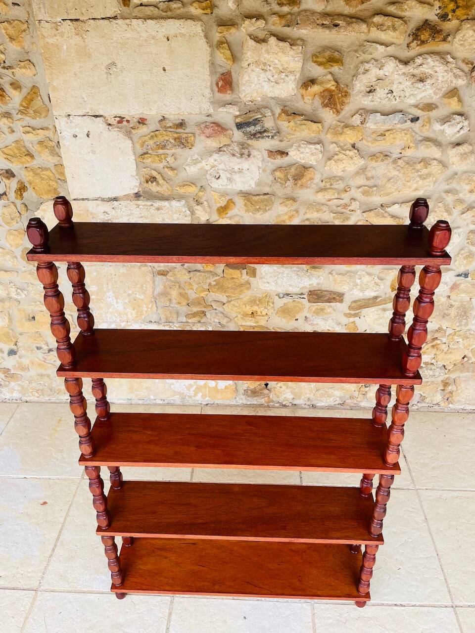 Vintage 5-tier turned wood shelf on legs.