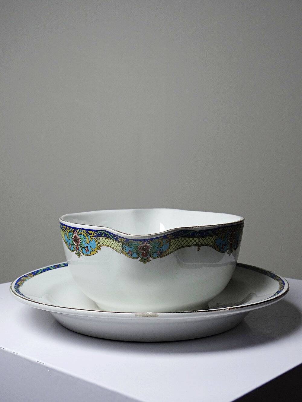 Old Luneville sauce boat, opaque porcelain with polychrome decoration.