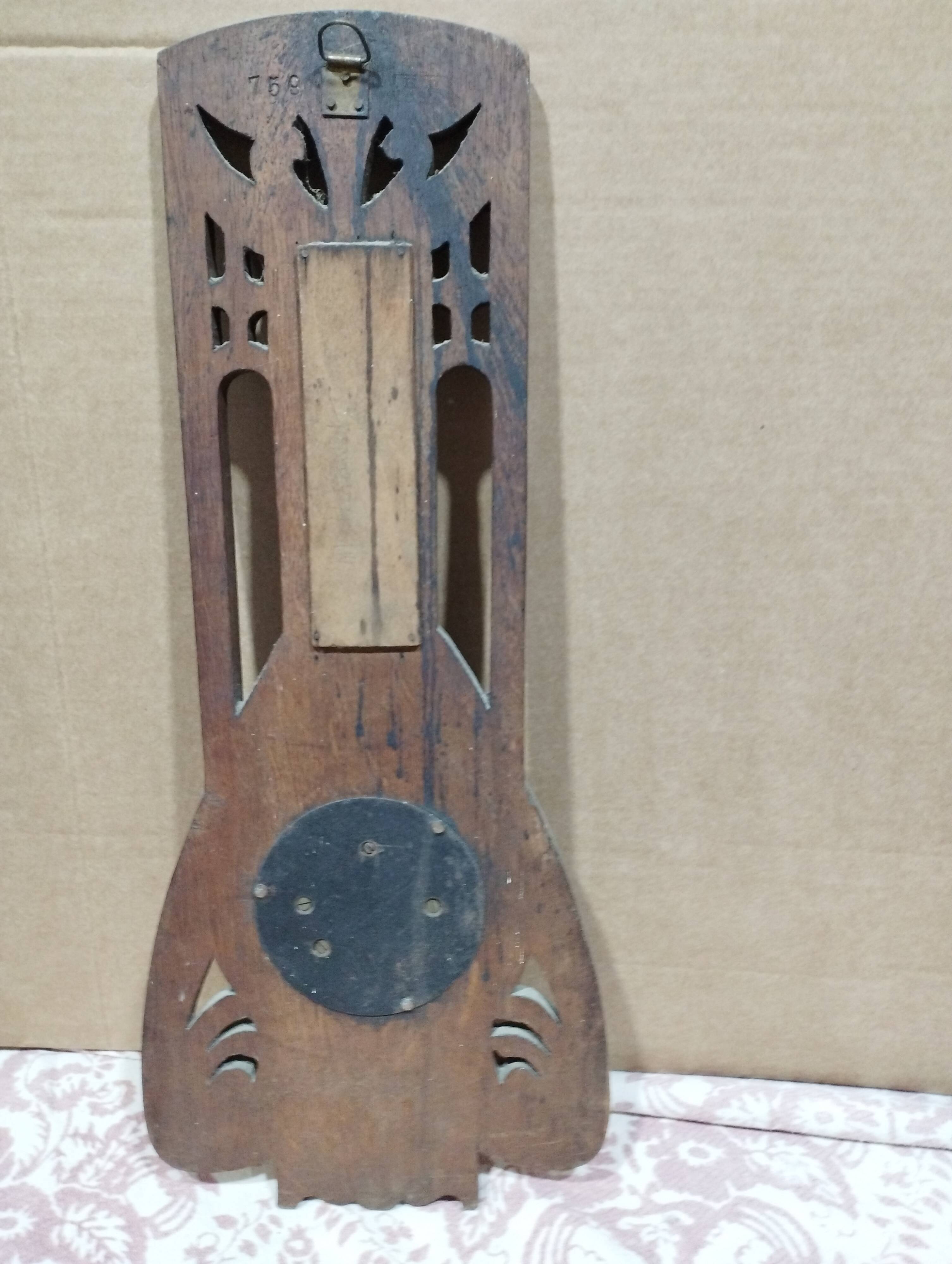 Old barometer and thermometer from the 1930s in carved wood. Signed on the back EH PARIS.