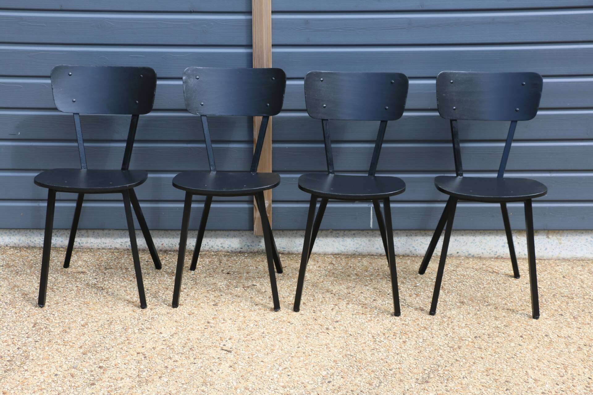4 black metal and wood chairs