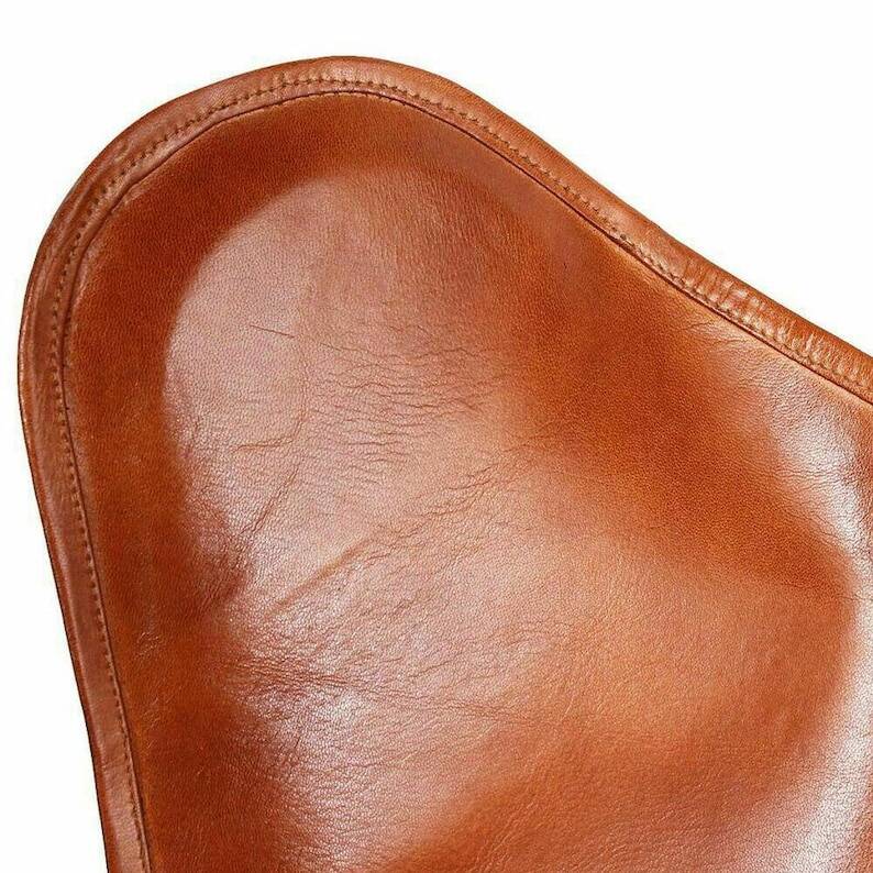 Handmade leather butterfly chair, modern lounge seating.