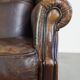 Wing chair made of sheepskin and neatly finished with black piping