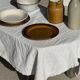 Small thick stoneware bowl with a stylised flower pattern in white on the outside, b