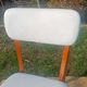 vintage wooden chairs with white faux leather