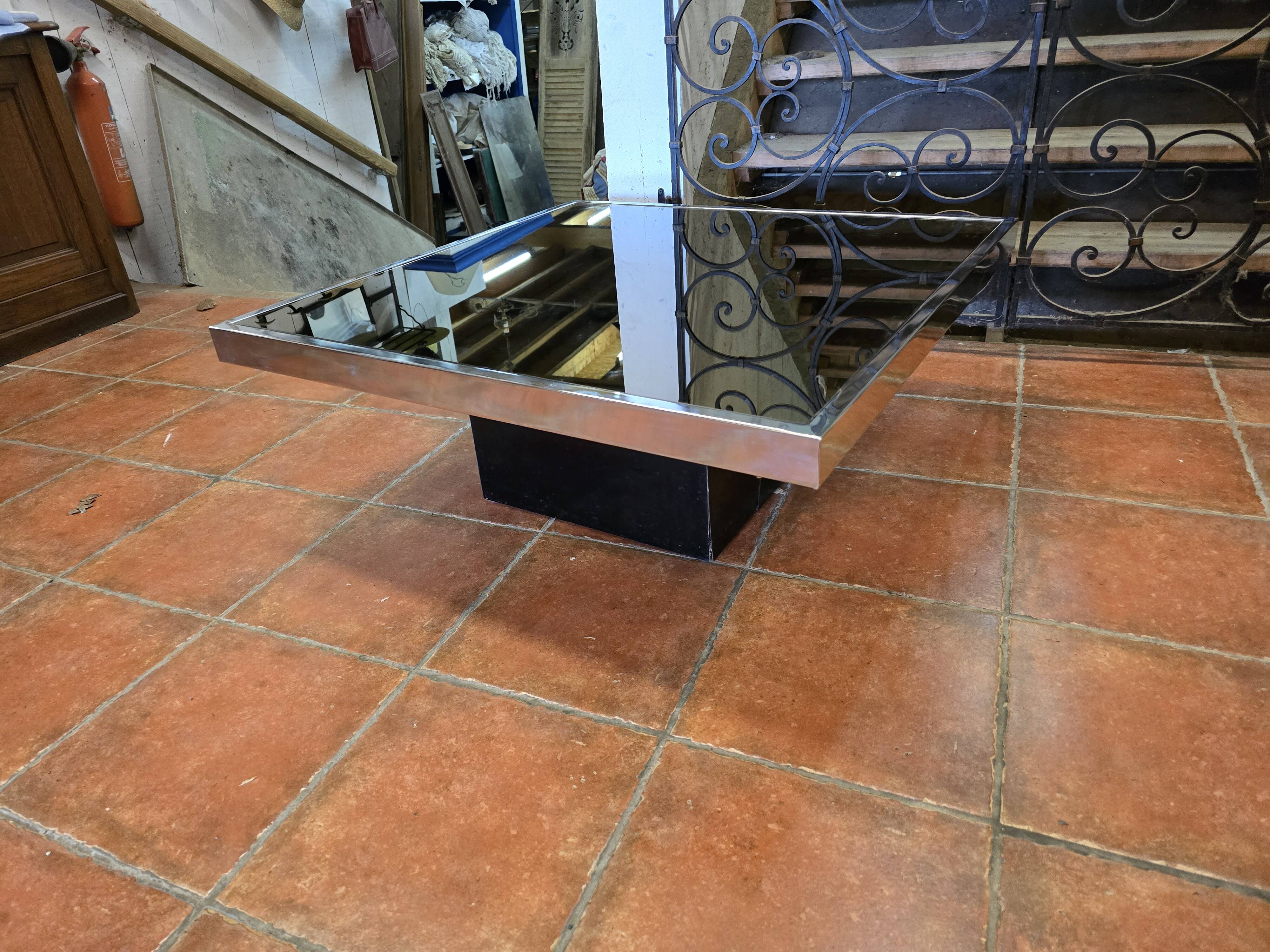 Chrome coffee table with smoked mirror top